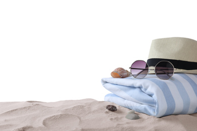Composition with beach objects on sand against white background. Space for text