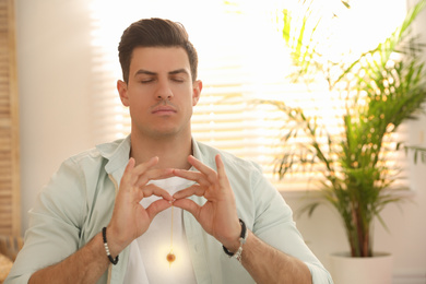 Man during self-healing session in therapy room