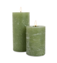 Photo of New pillar wax candles on white background