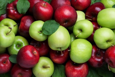 Fresh ripe green and red apples as background, top view