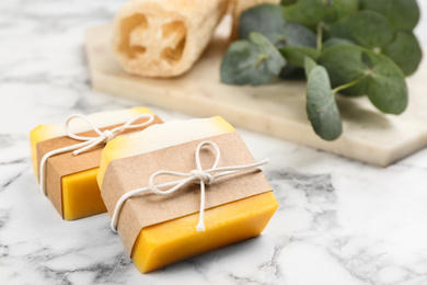Natural handmade soap bars on marble table