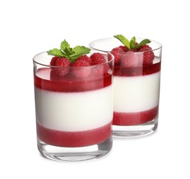Delicious panna cotta with raspberry coulis and fresh berries on white background