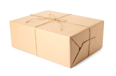 Parcel wrapped with kraft paper and twine isolated on white