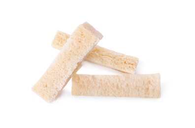 Crispy rusks on white background, top view