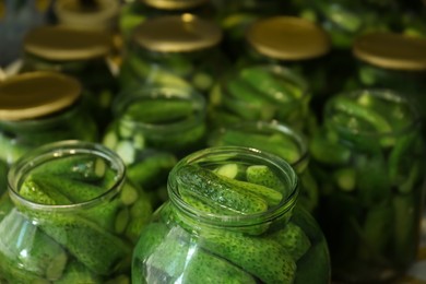 Pickling jars with fresh ripe cucumbers, closeup