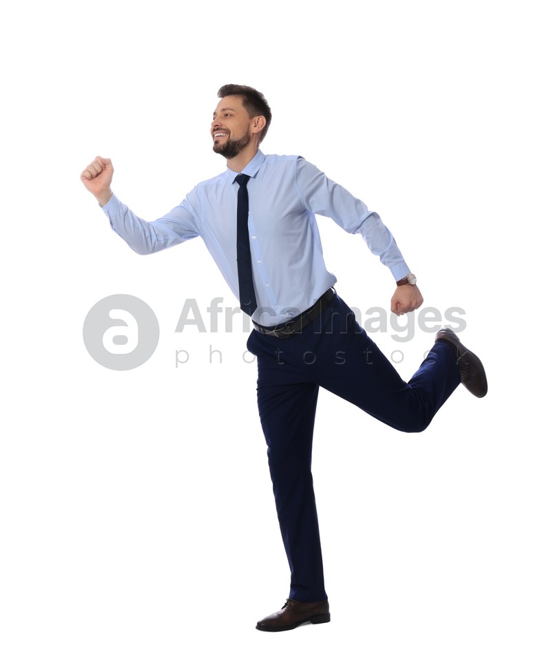 Handsome bearded businessman running on white background