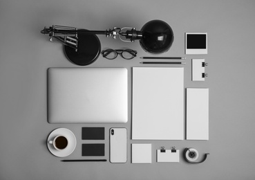 Flat lay composition with stationery on grey background. Mock up for design