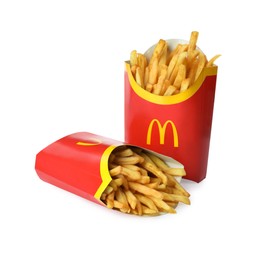 MYKOLAIV, UKRAINE - AUGUST 12, 2021: Two big portions of McDonald's French fries on white background