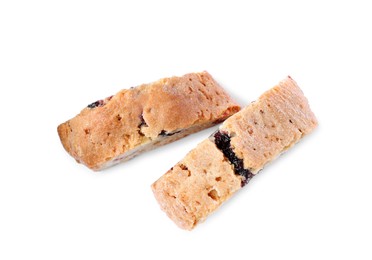 Slices of tasty cantucci with berry on white background, top view. Traditional Italian almond biscuits