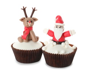 Beautiful Christmas cupcakes with Santa Claus and reindeer on white background