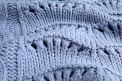 Photo of Blue knitted sweater as background, closeup view
