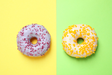 Delicious glazed donuts on color background, flat lay