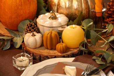Beautiful autumn place setting and decor on table, closeup