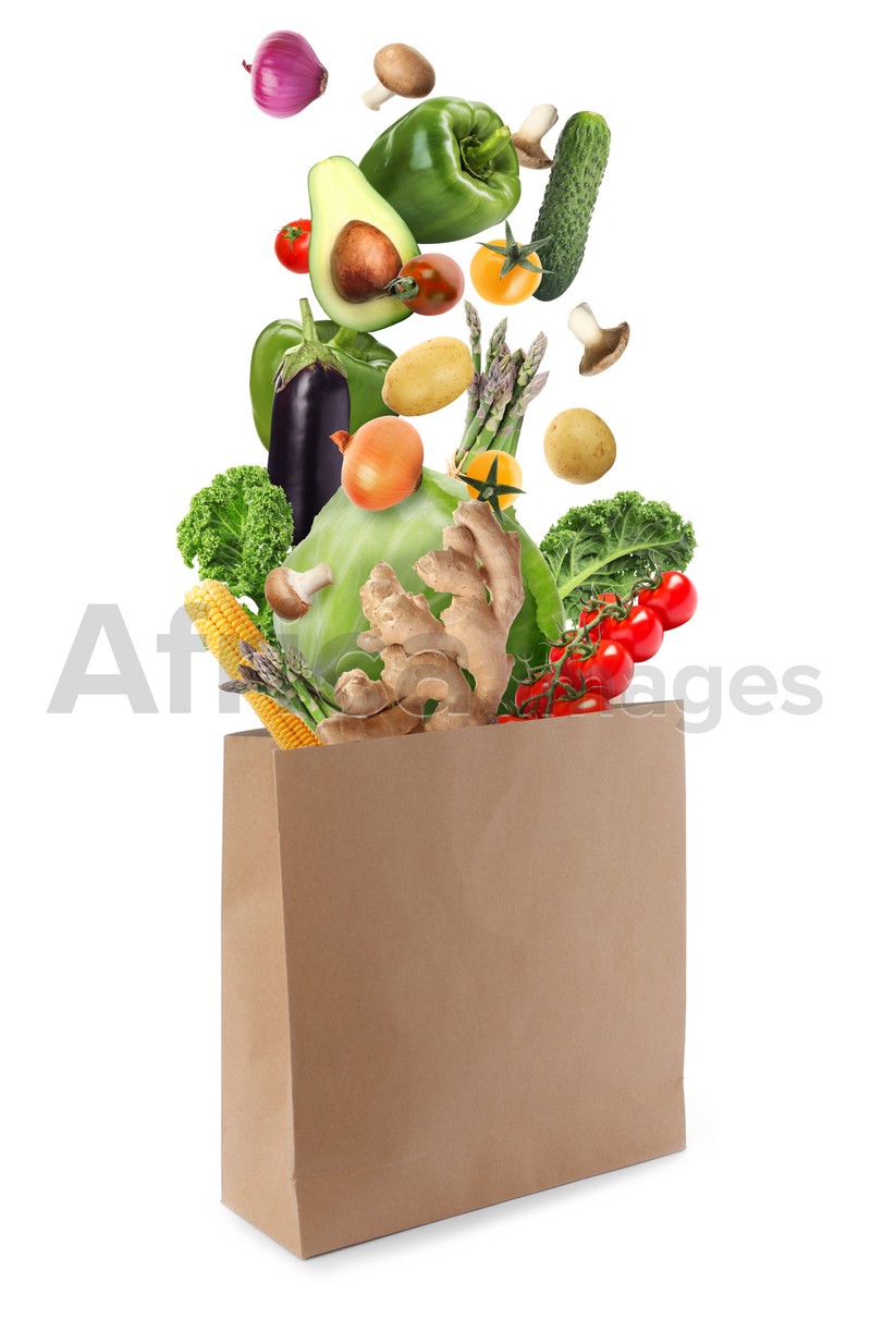 Image of Paper bag with vegetables on white background. Vegetarian food 