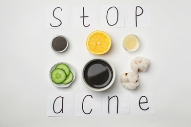 Phrase "Stop acne" and homemade effective problem skin remedy on white background