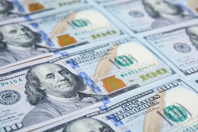 Photo of Many dollar banknotes as background, closeup view