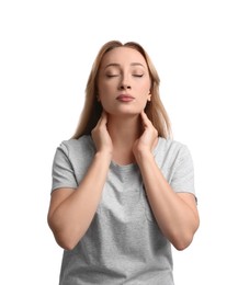 Young woman doing thyroid self examination on white background