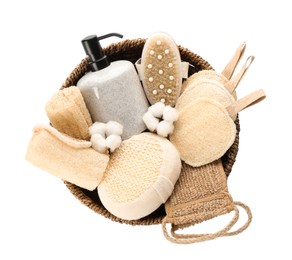 Set of toiletries with natural loofah sponges in wicker basket isolated on white, top view