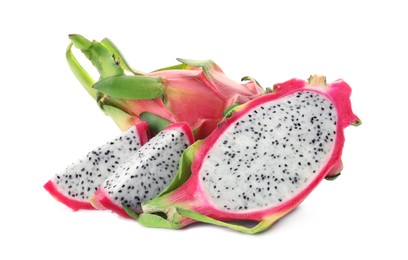 Delicious cut and whole pitahaya fruits on white background
