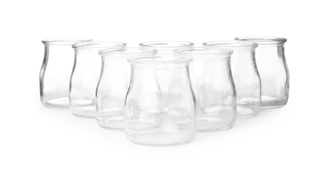 Empty clear glass jars isolated on white