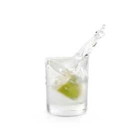 Shot of vodka with lime slice and splash isolated on white