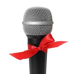 Microphone with red bow isolated on white, closeup. Christmas music