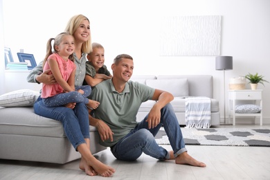 Happy family with children in living room