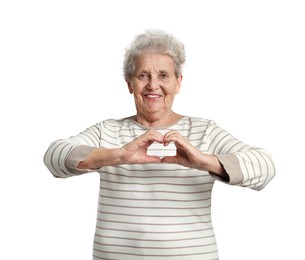 Elderly woman making heart with her hands on white background