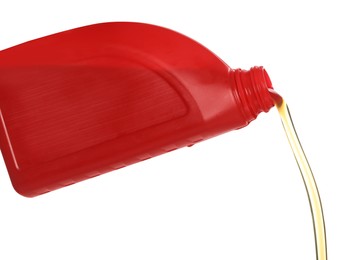 Man pouring motor oil from red container on white background, closeup