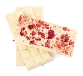 Photo of Chocolate bars with freeze dried raspberries on white background, top view