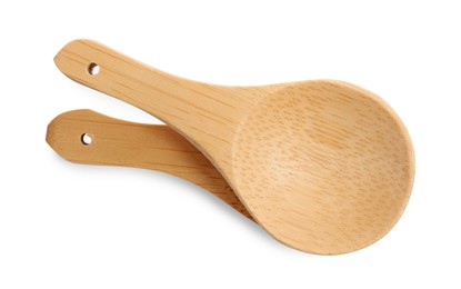 Photo of Wooden spoons on white background, top view