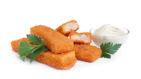 Fresh breaded fish fingers with parsley and sauce on white background