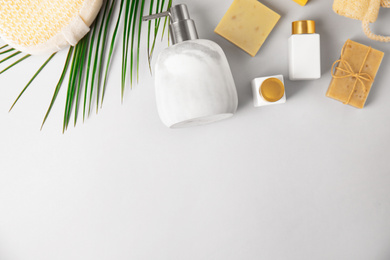Flat lay composition with marble soap dispenser on white background. Space for text