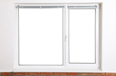 Modern window with blinds in empty room