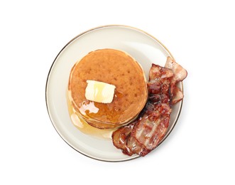 Delicious pancakes with maple syrup, butter and fried bacon on white background, top view
