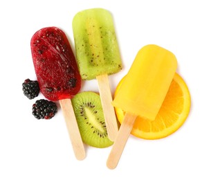 Delicious ice popsicles and fresh fruits on white background, top view