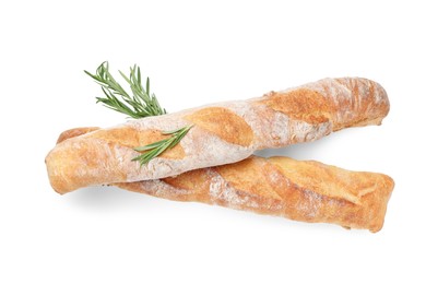 Crispy French baguettes with rosemary on white background, top view. Fresh bread