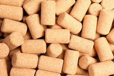 Many wine bottle corks as background, top view