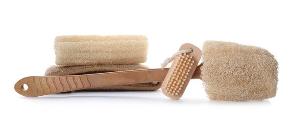 Photo of Natural shower loofah sponges and brush isolated on white