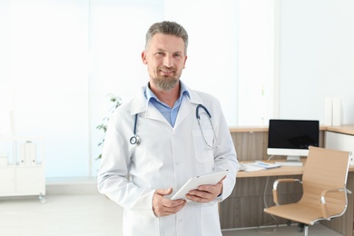 Photo of Male medical assistant in clinic. Health care service
