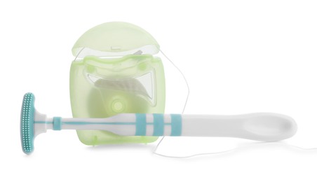 New tongue cleaner and dental floss on white background
