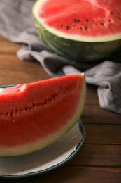 Sliced fresh juicy watermelon on wooden table, closeup