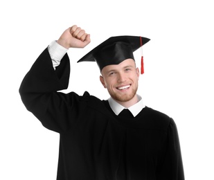 Photo of Happy student wearing graduation hat on white background