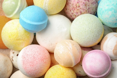 Photo of Many bath bombs as background, top view