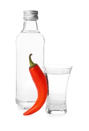 Red hot chili pepper and vodka on white background