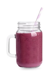 Photo of Mason jar of tasty blackberry smoothie on white background
