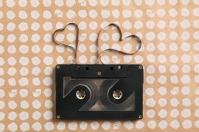 Music cassette and hearts made with tape on color background, top view. Listening love song