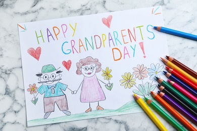 Beautiful drawing on white marble table, flat lay. Happy Grandparents Day