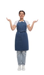 Photo of Young woman in blue apron on white background