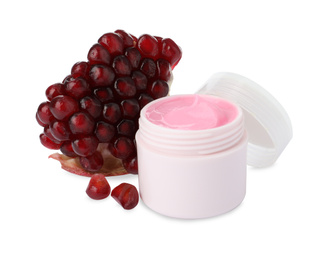 Fresh pomegranate and jar of facial mask on white background. Natural organic cosmetics